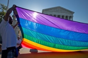  Supporters of same-sex marriage gathered at the Supreme Court on Tuesday as it heard arguments on whether to strike down bans on such marriages. Credit Stephen Crowley/The New York Times 